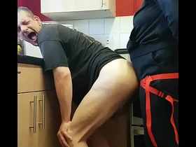 girlfriend surprises bisexual boyfriend with a strap-on assfuck in the kitchen